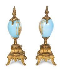 A Pair of Sèvres Style Porcelain Small Urns with Gilt Metal Mounts