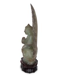 A Chinese Carved White Jade Seated Buddha Under Halo — 20TH CENTURY