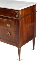 A Louis XVI Style Gilt Bronze Mounted Mahogany Marble-Top Commode