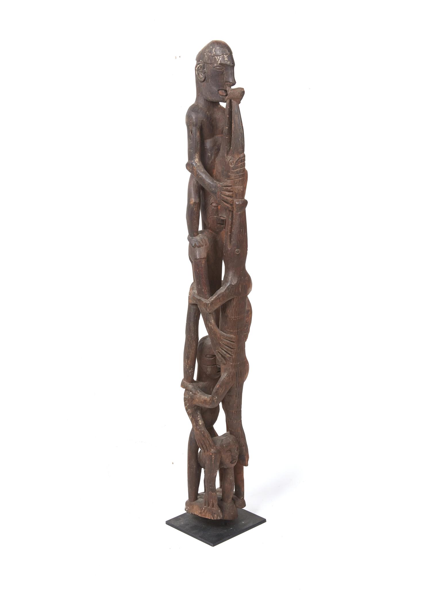An Asmat Figure COMBINED WITH 31