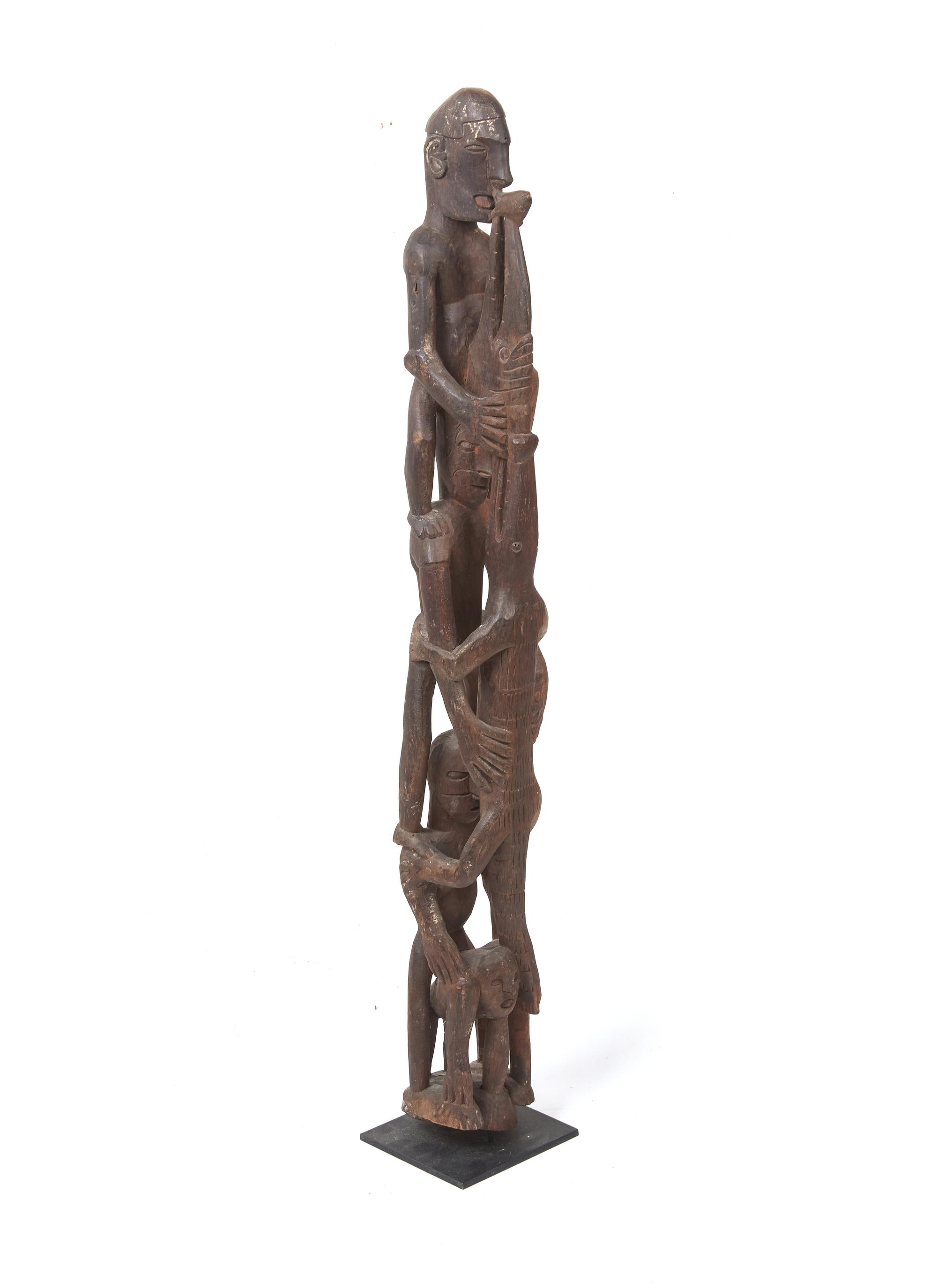 An Asmat Figure COMBINED WITH 31