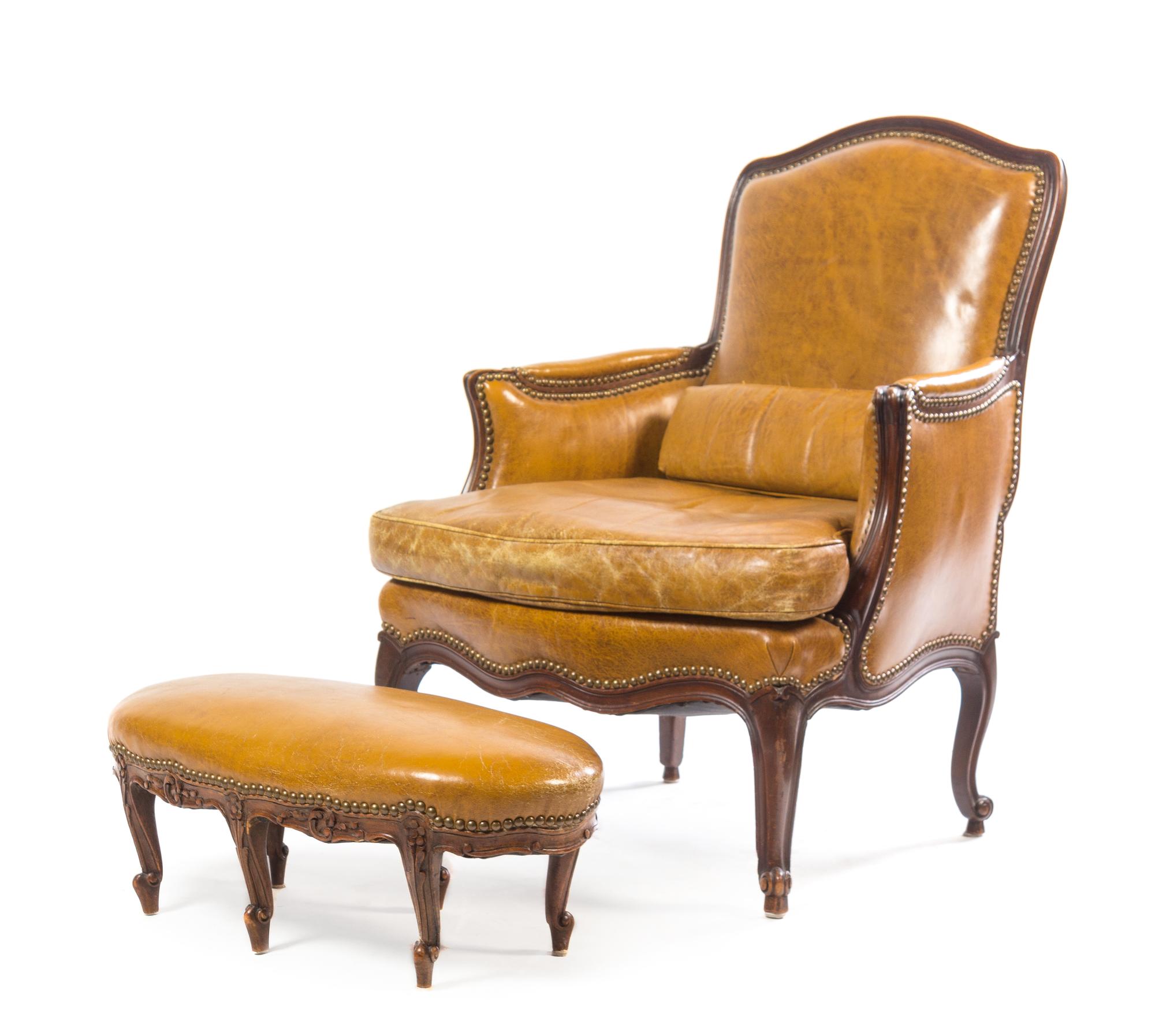 A Louis XV Style Walnut Bergere and Tabouret Height of bergere 36 inches. — LATE 19TH CENTURY