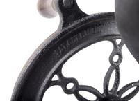 A Landers, Frary & Clark Cast Iron Coffee Mill with an Eagle Finial