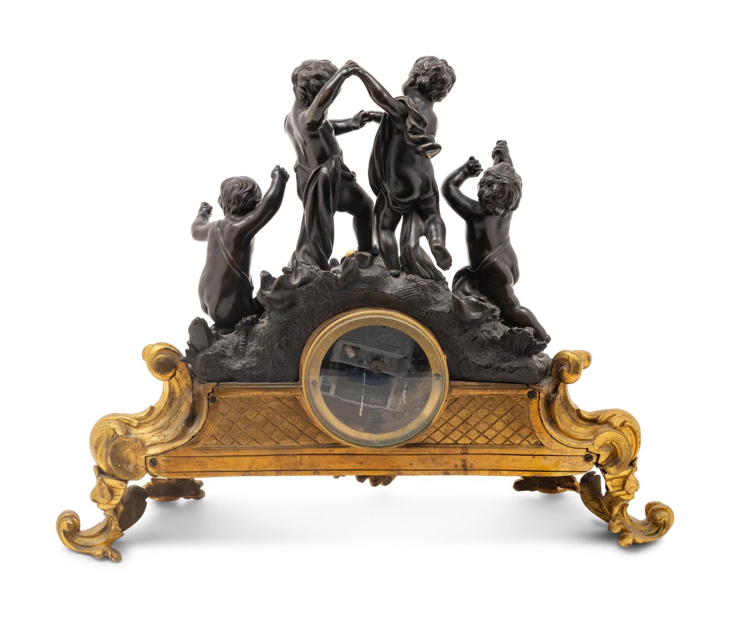 A French Gilt and Patinated Bronze Figural Mantel Clock