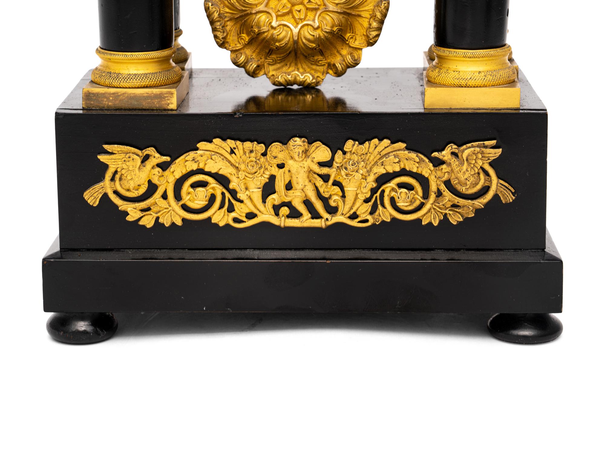 A Charles X Gilt Bronze Mounted Ebonized Fruitwood Clock