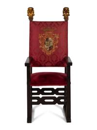 An Italian Baroque Style High Back Arm Chai r