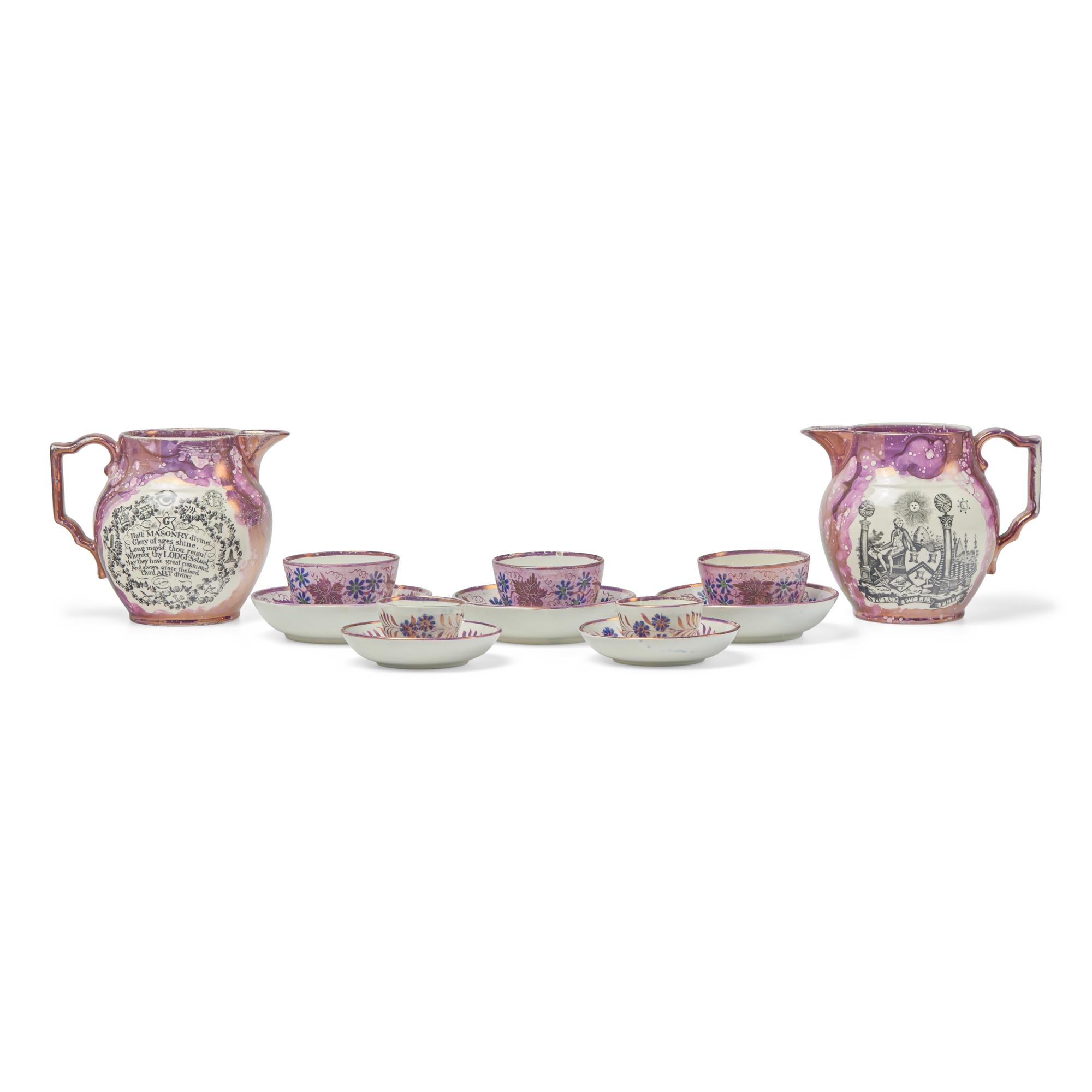 A Pair of Staffordshire Pink Sunderland Lustreware Masonic Water Pitchers, Together with Five Tea Bowls and Saucers