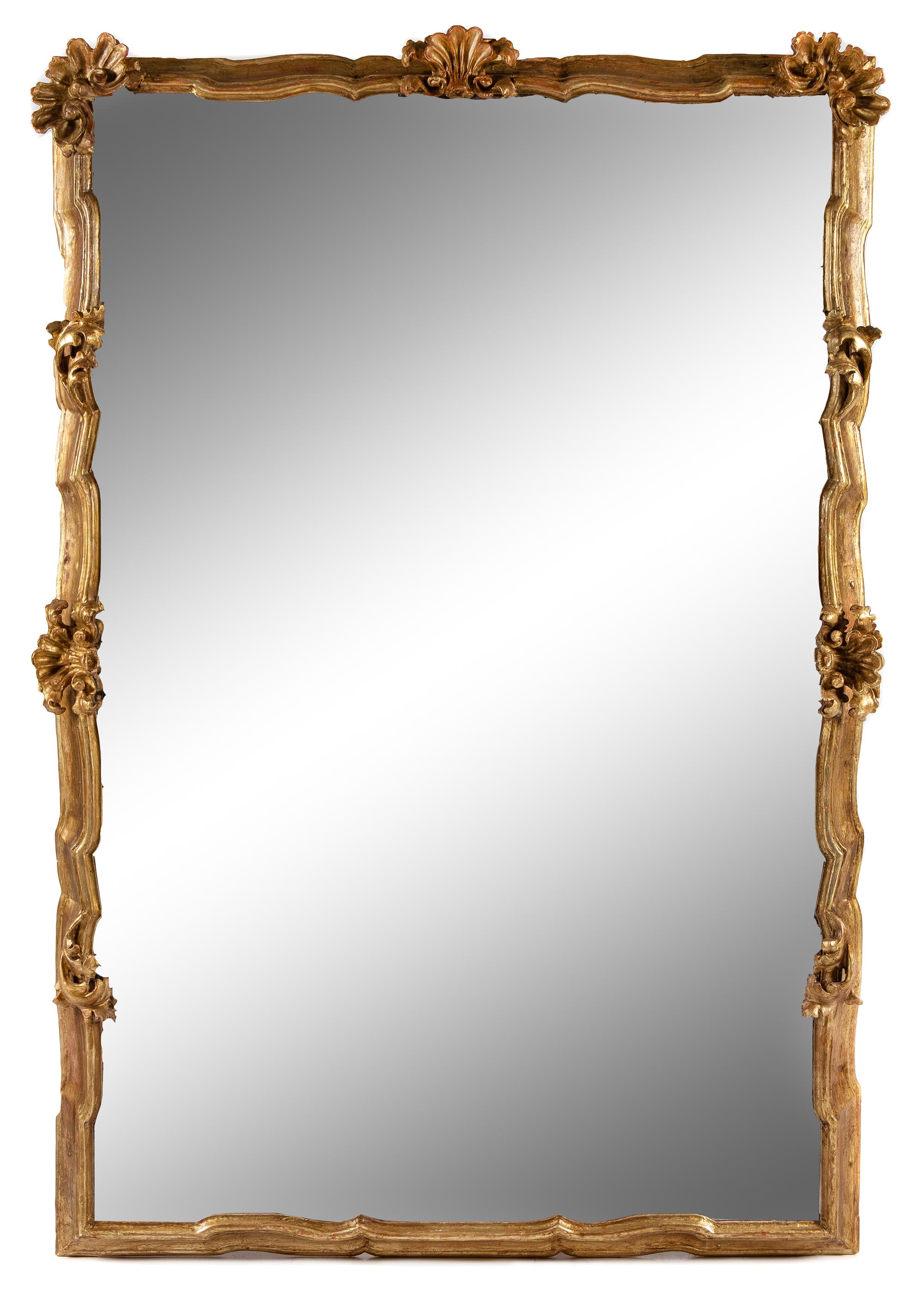 An Italian Baroque Style Giltwood Mirror Height 84 x width 54 inches. — 18TH/19TH CENTURY