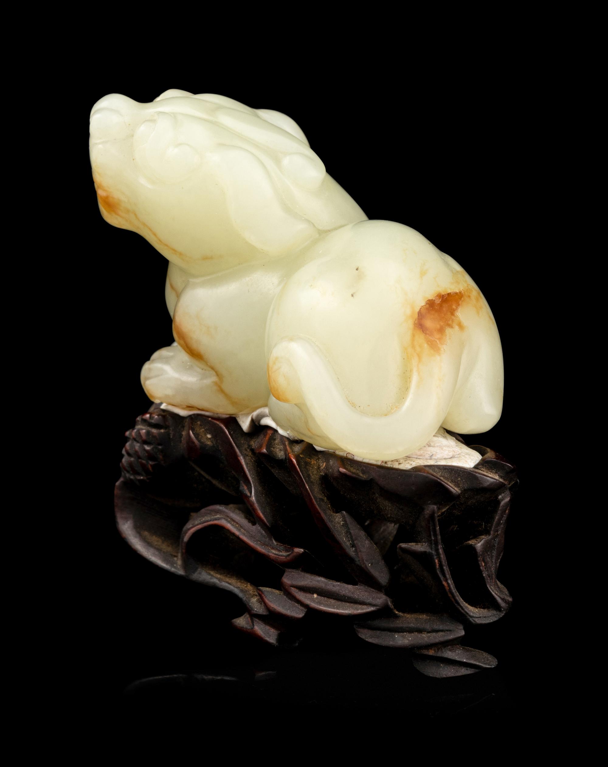 A Carved Russet and White Jade Figure of Mythical Beast, Tianlu