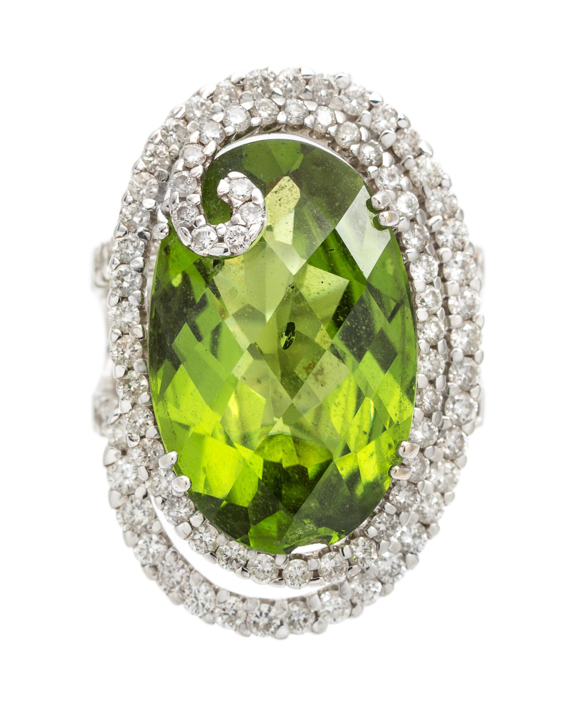An 18 Karat White Gold, Peridot and Diamond Ring, 16.80 dwts.