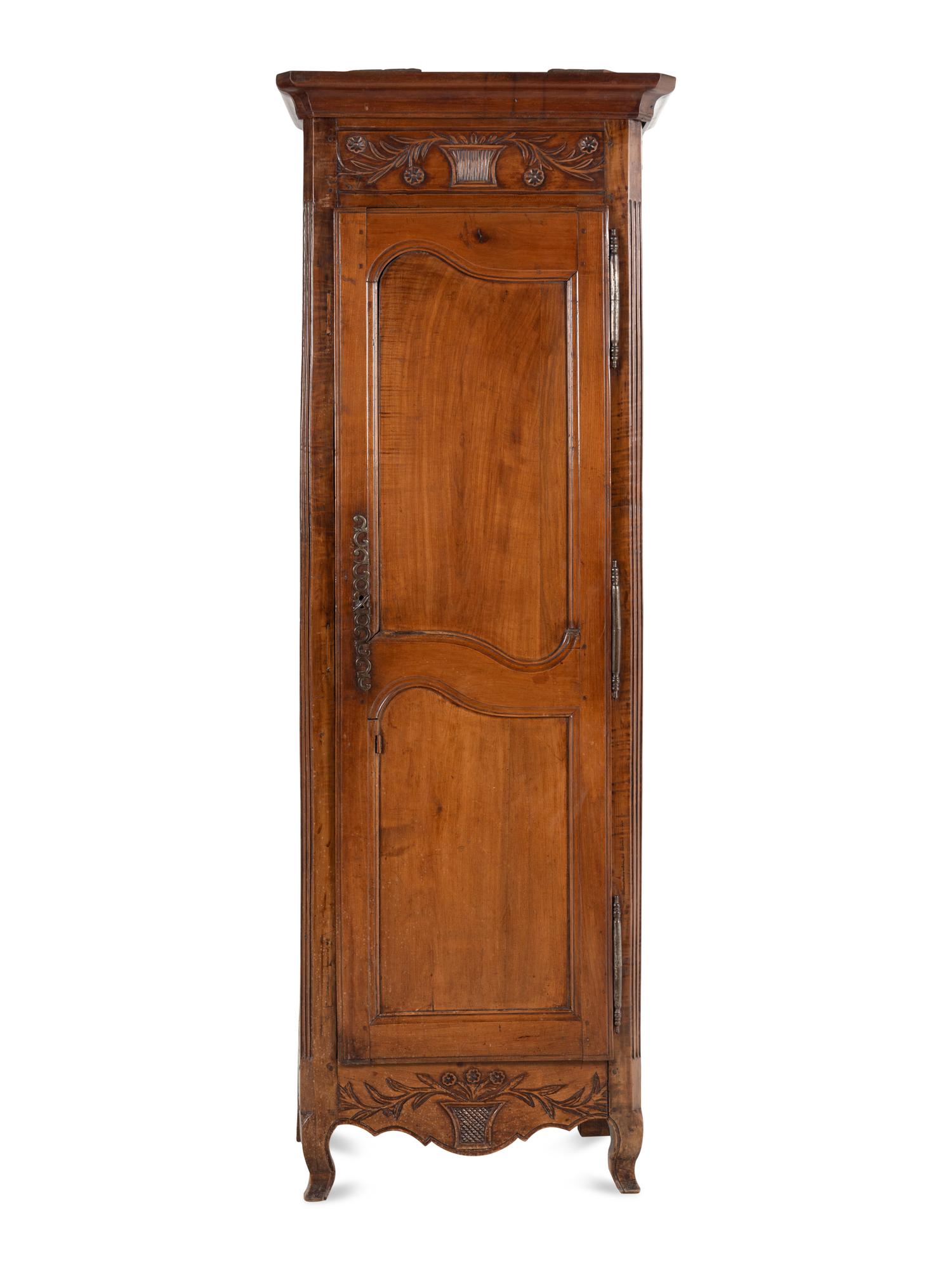 A Louis XV Provincial Walnut Cabinet