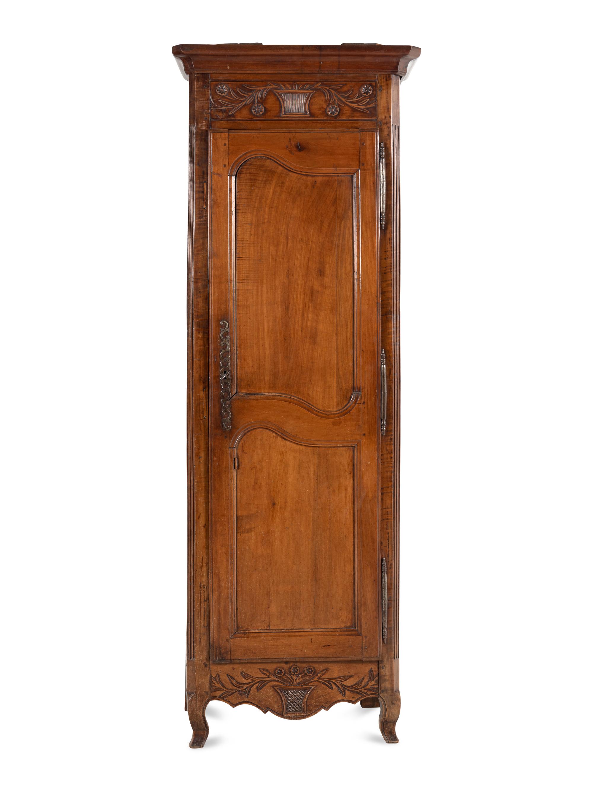 A Louis XV Provincial Walnut Cabinet