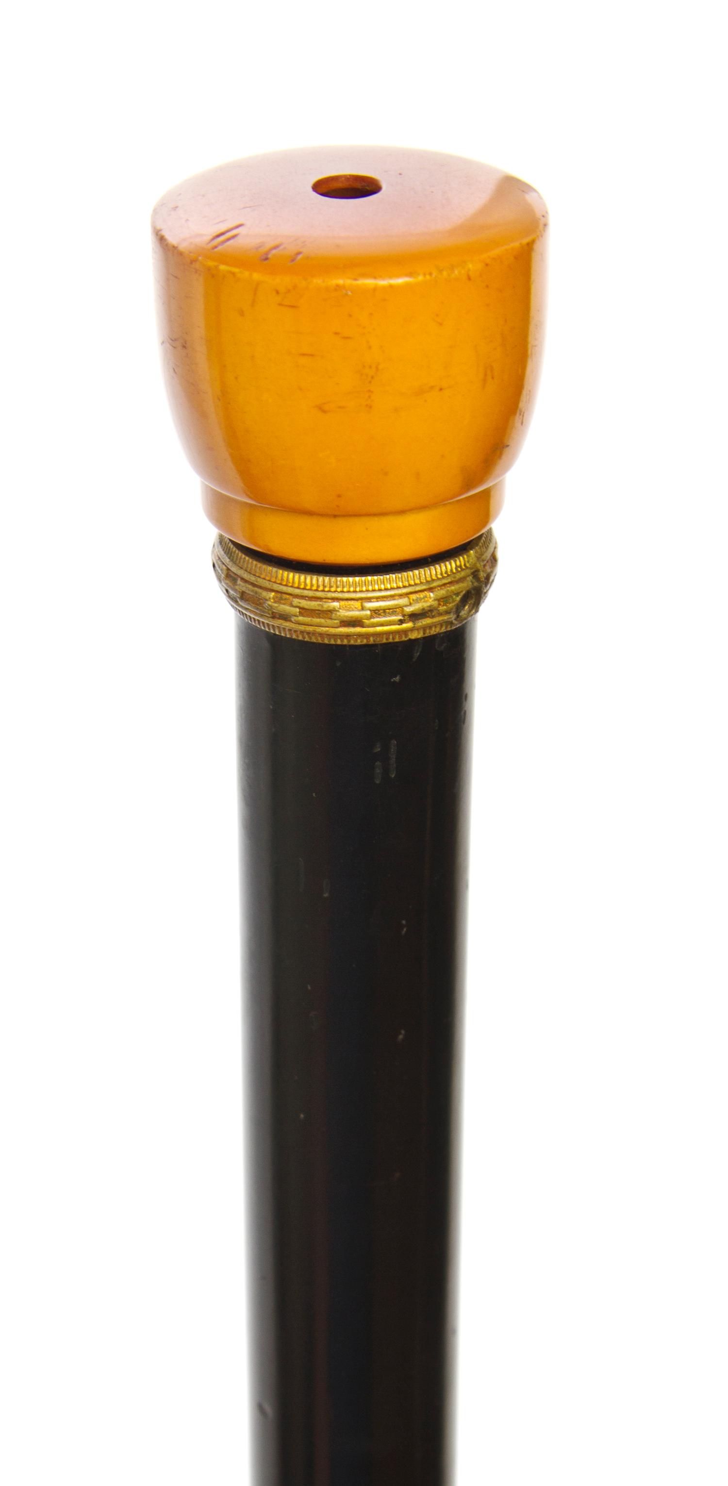 An American Bakelite Handled Flashlight Walking Stick, Length of handle 1 x length overall 35 1/4 inches.
