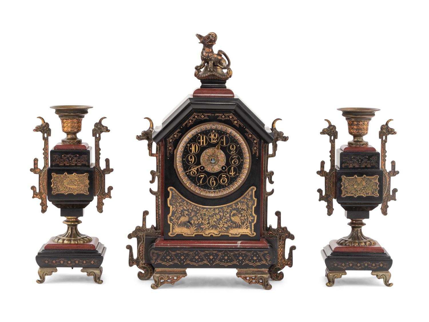 A French Gilt Bronze, Marble and Slate Clock Garniture