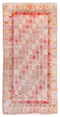 A Khotan Wool Rug 11 feet 9 inches x 6 feet 3 inches. — EAST TURKESTAN, LATE 19TH CENTURY