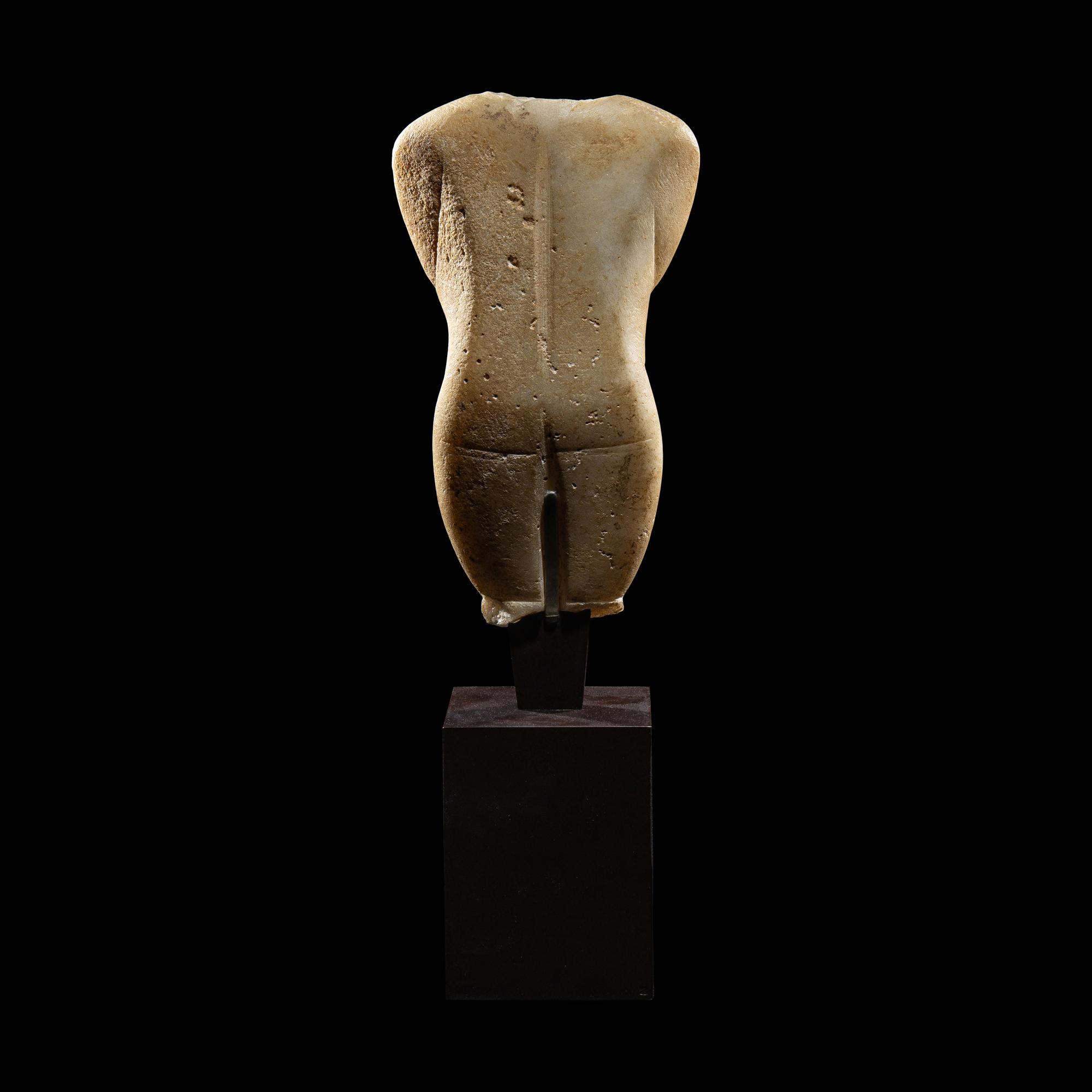 A Cycladic Marble Female Torso
