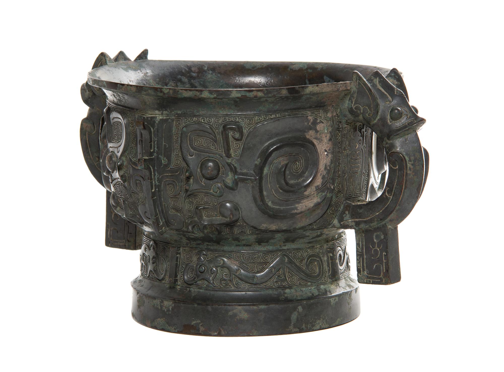 A Bronze Ritual Gui Vessel Width over handles 10 5/8 inches.