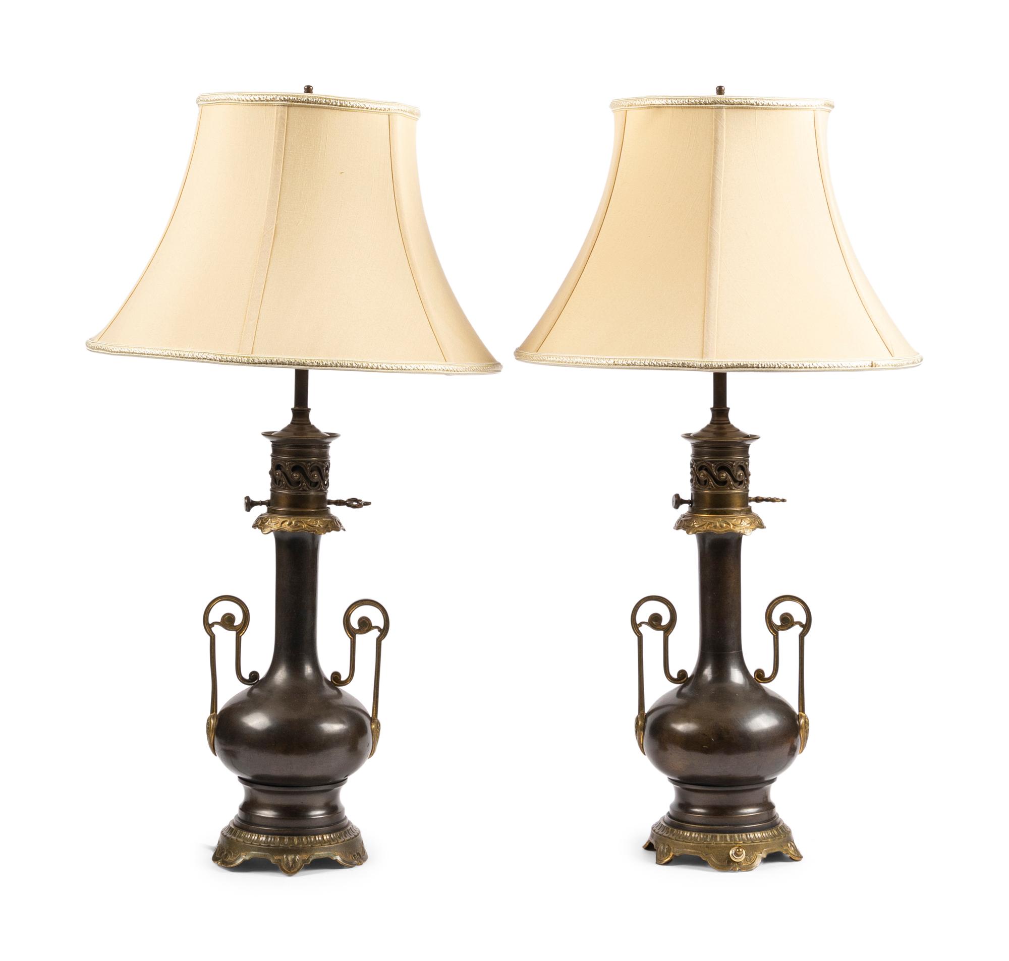 A Pair of French Gilt and Patinated Cast Metal Table Lamps