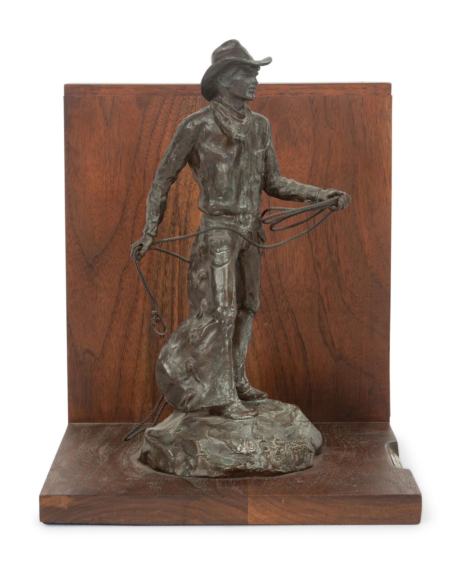 The Bronc Rider , edition 23/100, mounted as bookend; together with book, From Broncs to Bronzes: The Life and Work of Grant Speed by Don Hedgpeth