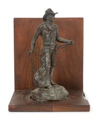 The Bronc Rider , edition 23/100, mounted as bookend; together with book, From Broncs to Bronzes: The Life and Work of Grant Speed by Don Hedgpeth