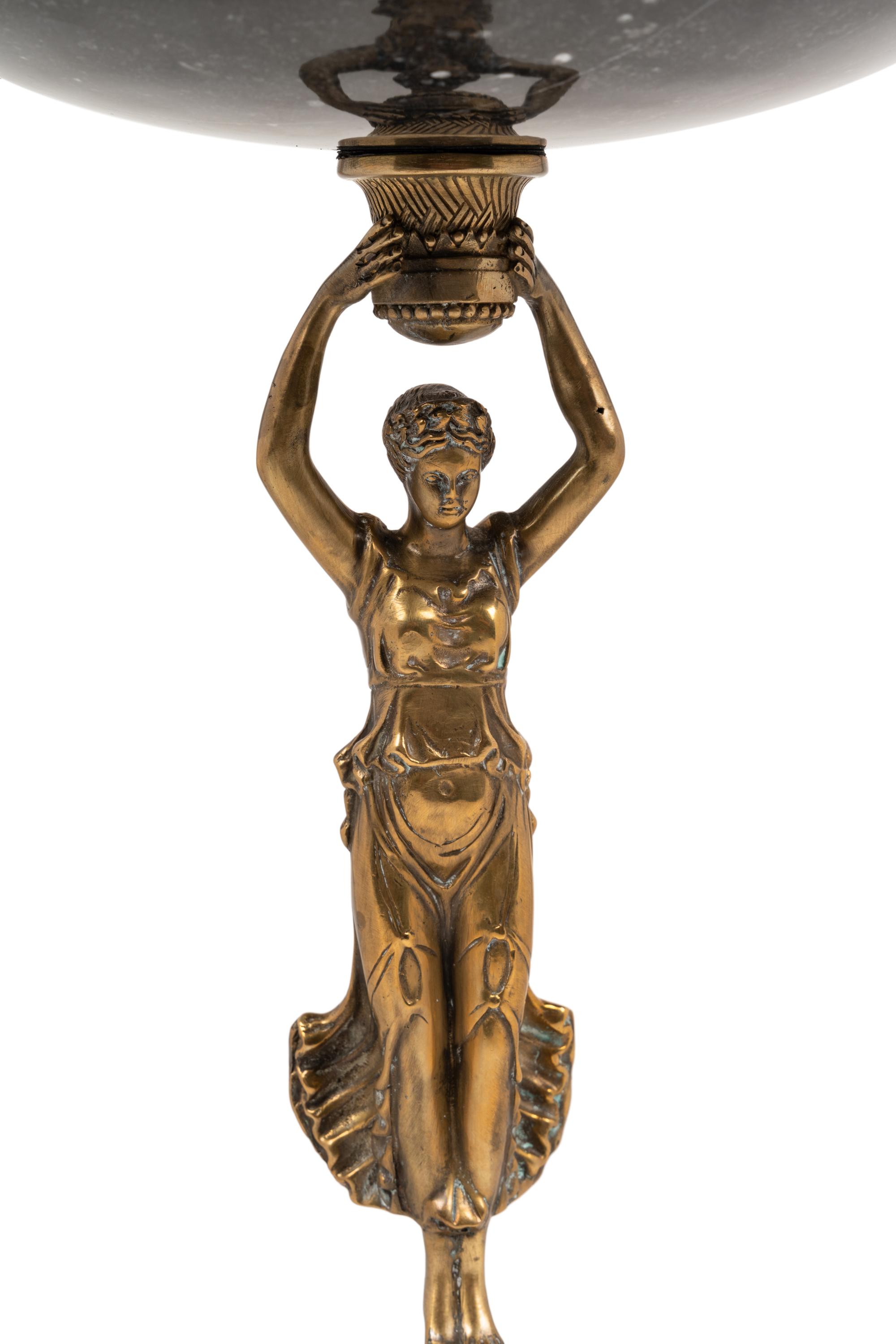 An Empire Style Gilt Metal and Marble Figural Centerpiece