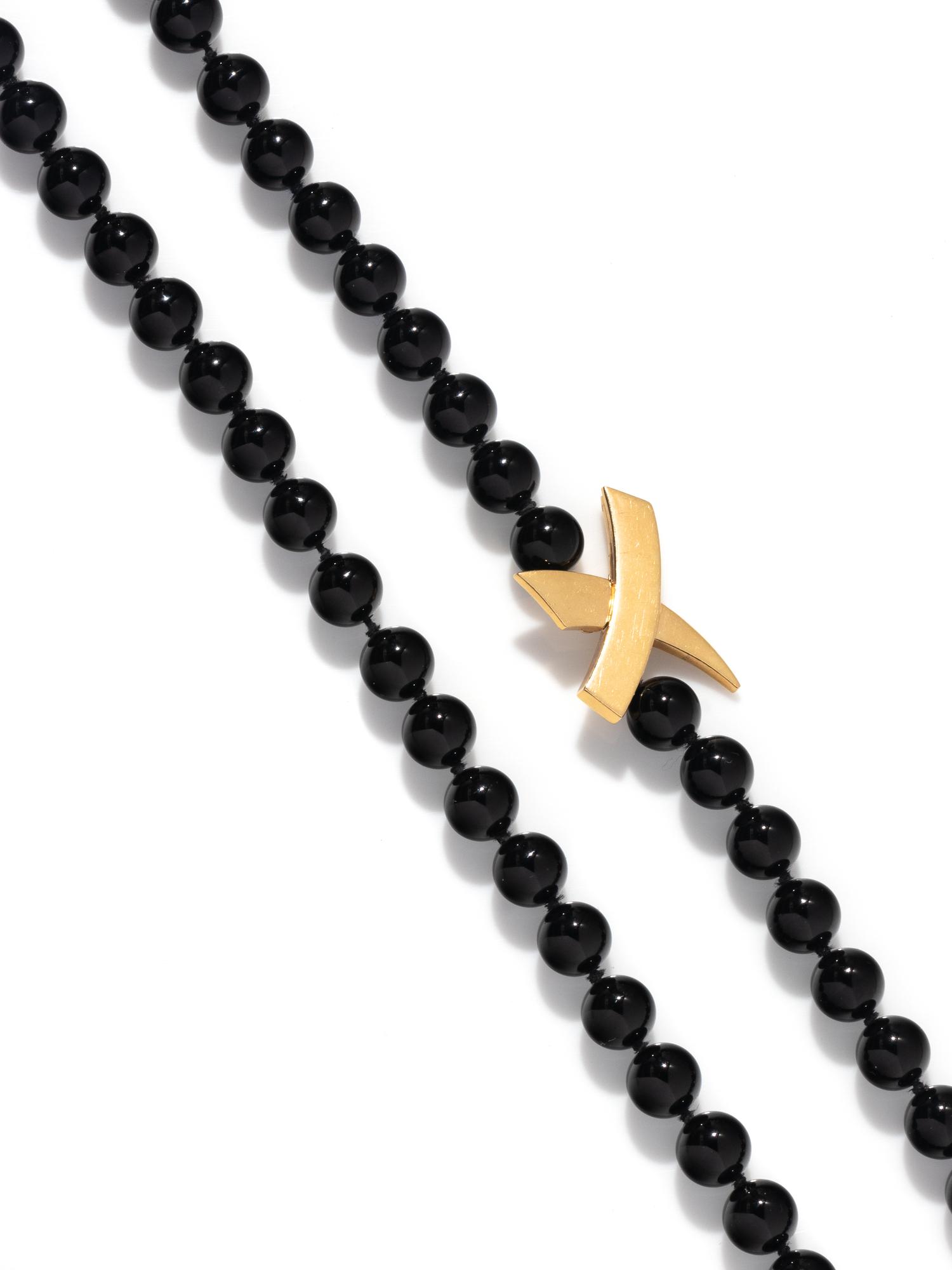 TIFFANY & CO., PALOMA PICASSO, FRENCH, YELLOW GOLD AND ONYX NECKLACE