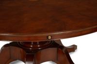 A Regency Style Mahogany Extending Circular Dining Table