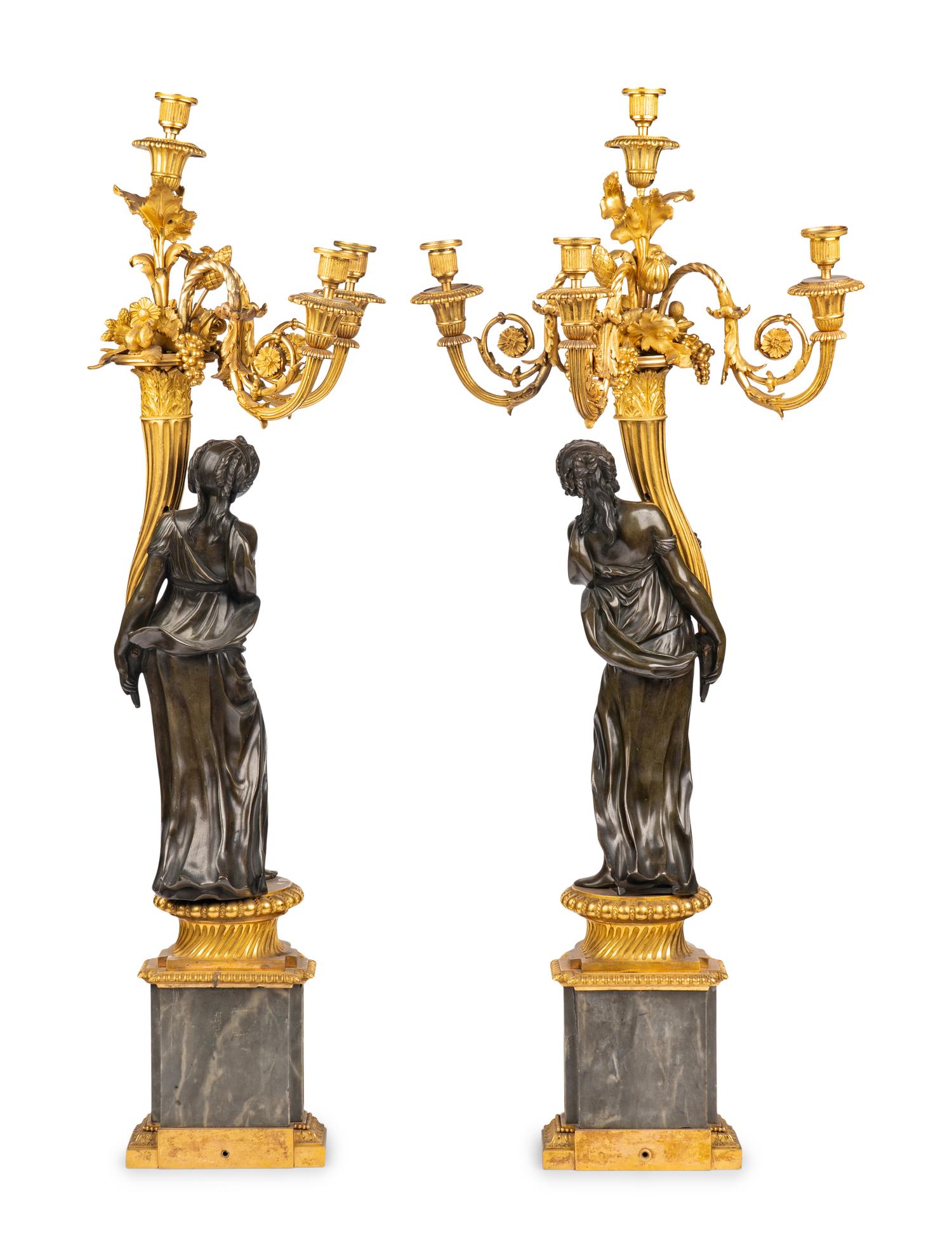 A Pair of Louis XVI Gilt and Patinated Bronze Four-Light Candelabra