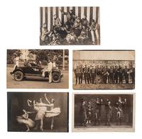 [EARLY PHOTOGRAPHY]. A group of 56 real photo postcards of performers and curious scenes and subjects from the United States and abroad, including: