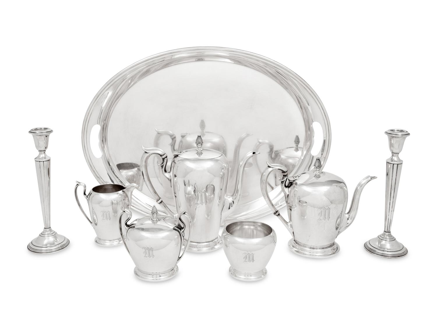 An American Silver Five-Piece Tea and Coffee Service and a Pair of Cartier Silver Candlesticks