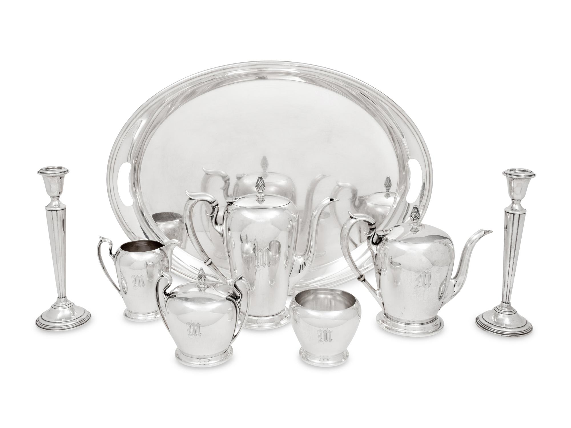 An American Silver Five-Piece Tea and Coffee Service and a Pair of Cartier Silver Candlesticks