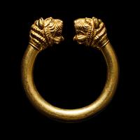 A Western Asiatic Gold Bracelet with Lion Headed Terminals