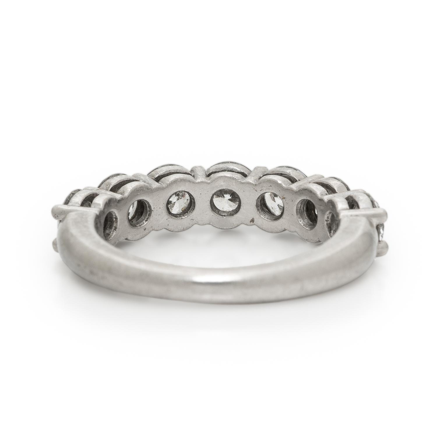 TIFFANY & CO., SEVEN DIAMOND AND PLATINUM RING