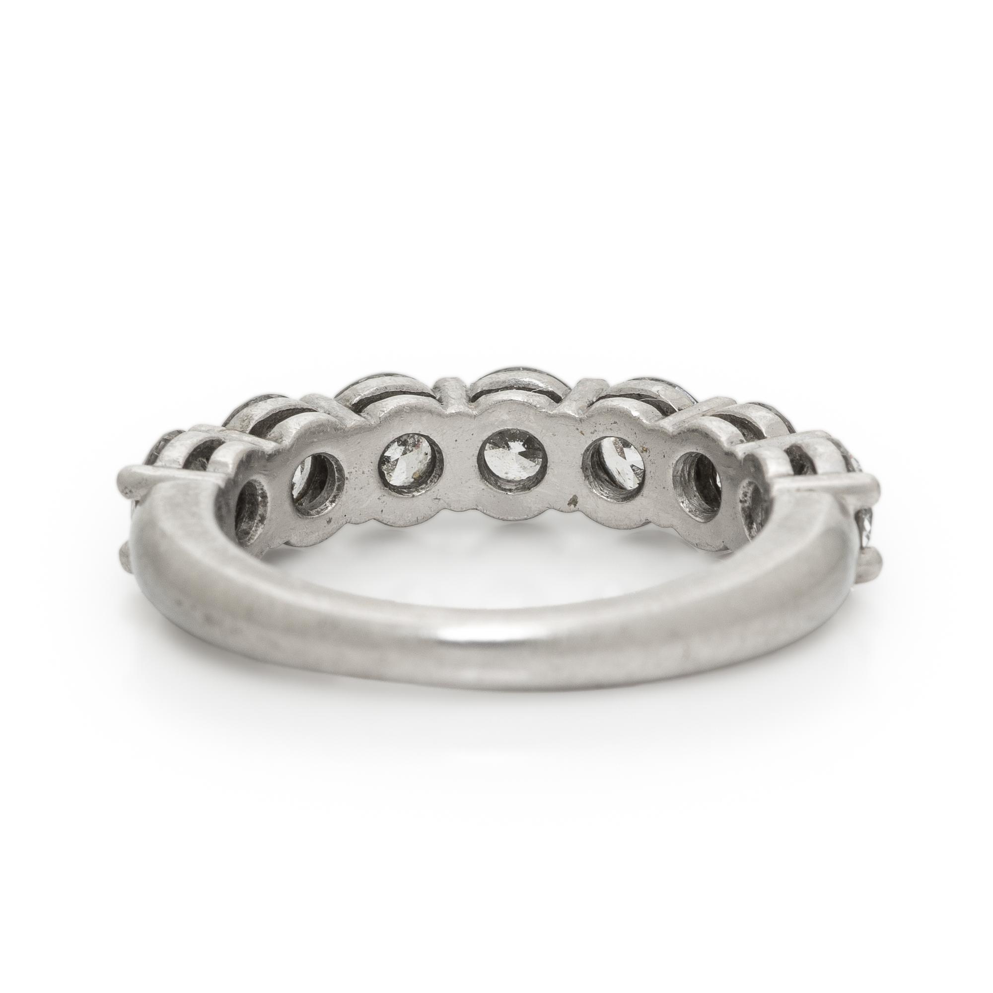 TIFFANY & CO., SEVEN DIAMOND AND PLATINUM RING
