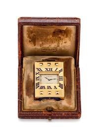An Art Deco 18 Karat Yellow Gold and Enamel 'Eclipse/Guillotine' Travel Clock, Cartier, Circa 1929, 42.45 dwts.