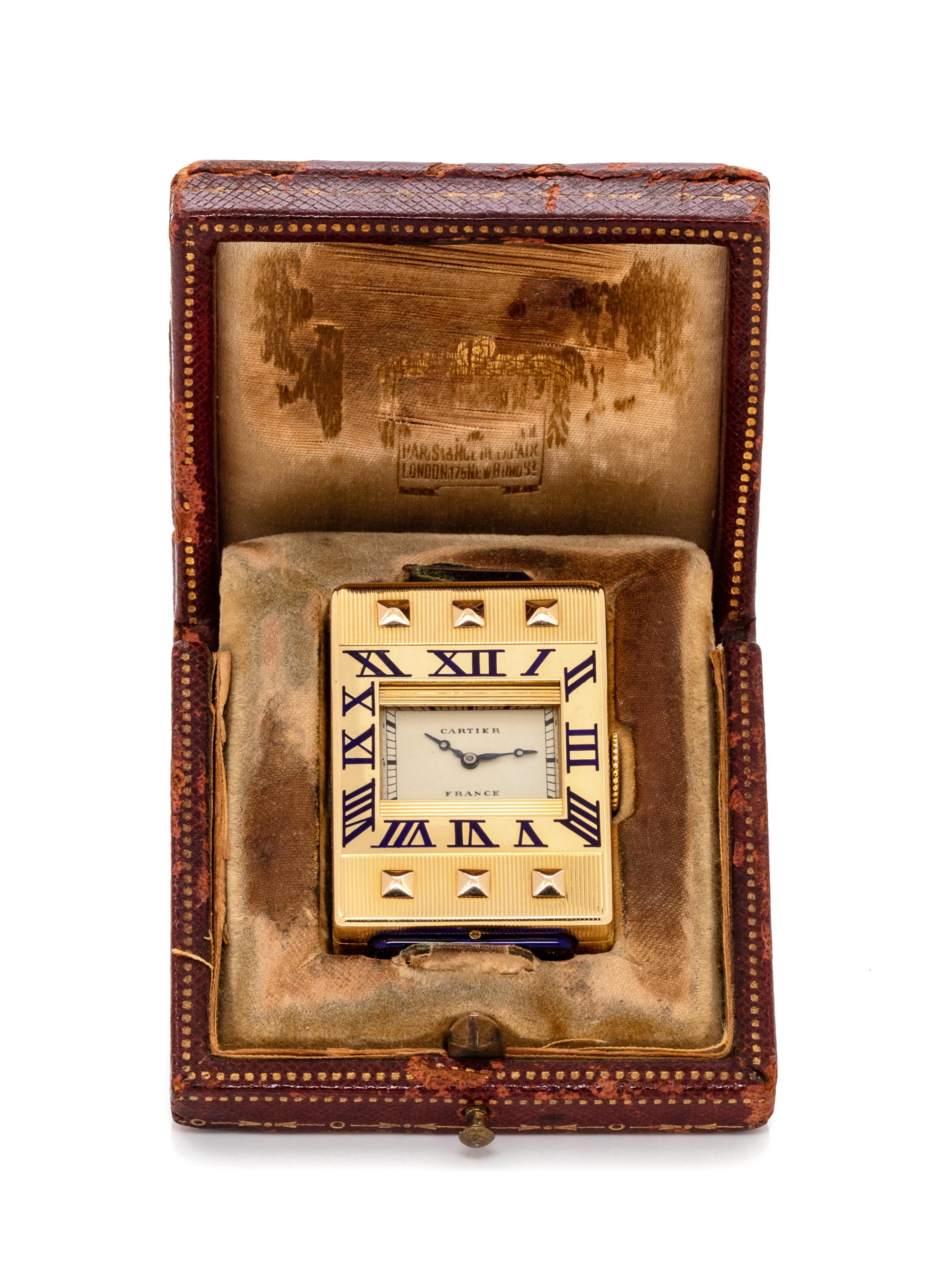 An Art Deco 18 Karat Yellow Gold and Enamel 'Eclipse/Guillotine' Travel Clock, Cartier, Circa 1929, 42.45 dwts.
