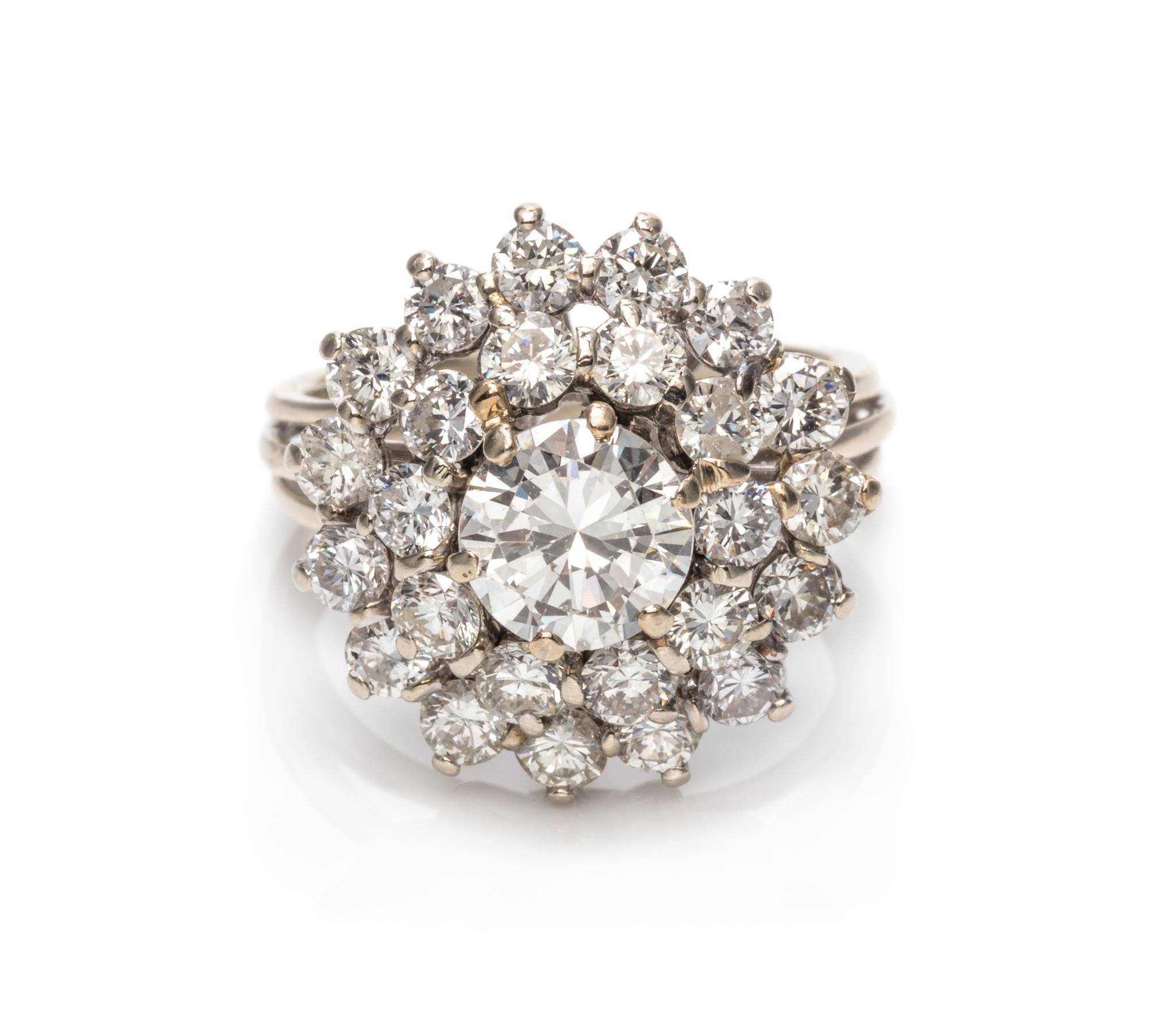 An 18 Karat White Gold and Diamond Cluster Ring,