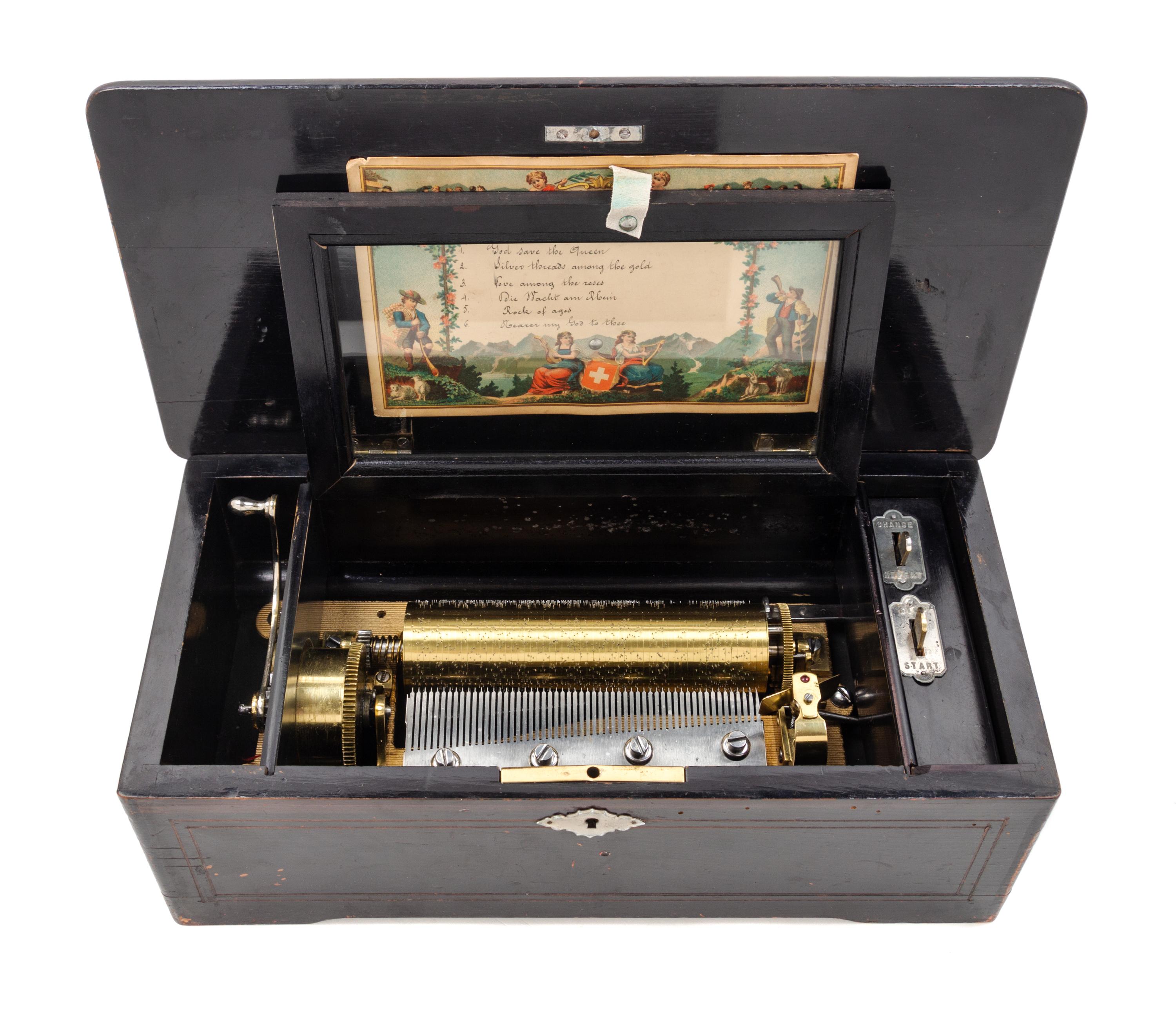 A Swiss Ebonized Music Box Height 5 x width 14 inches. — 19TH CENTURY