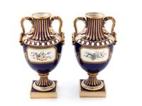 A Pair of Minton Painted and Parcel Gilt Porcelain Urns