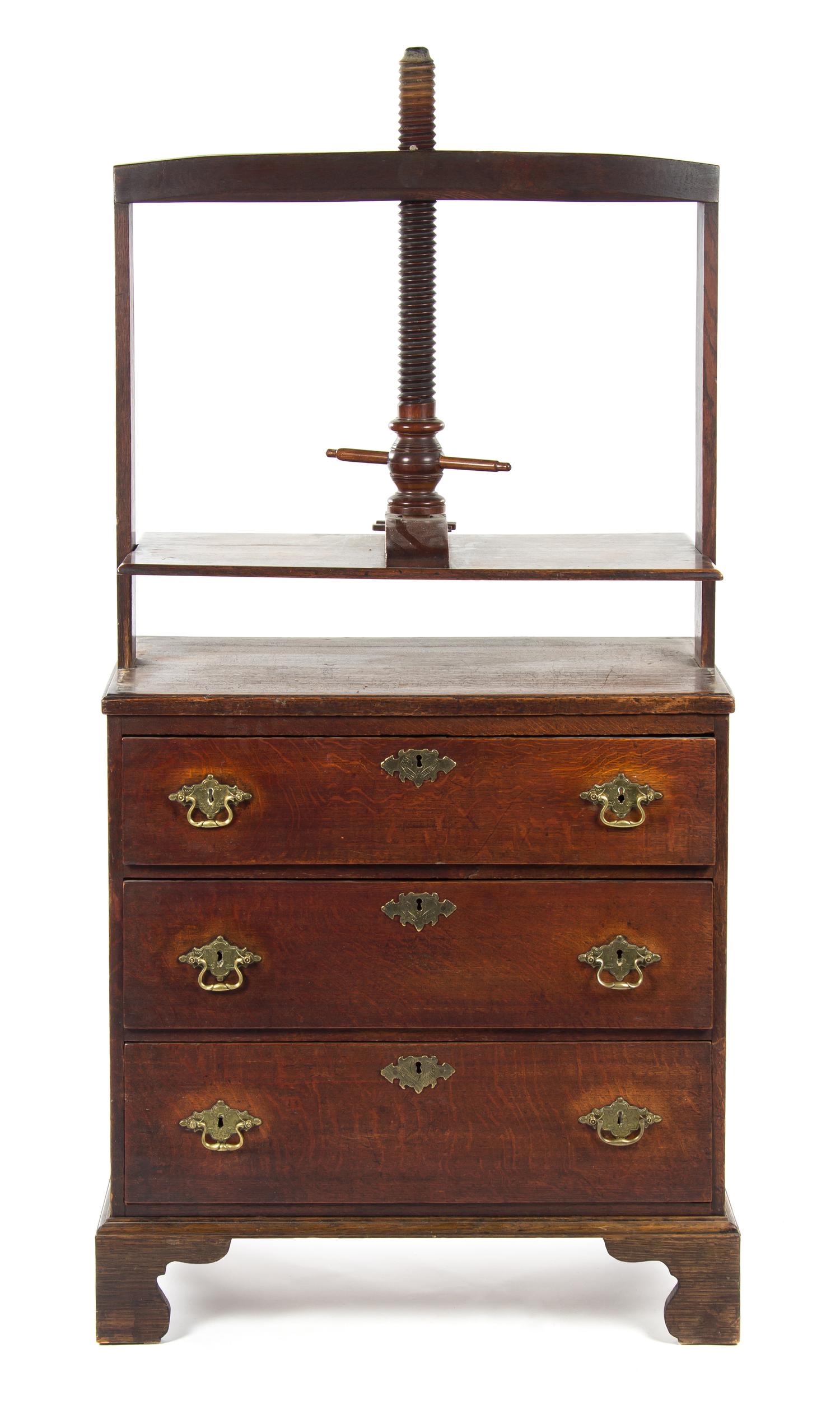 A George II Oak Linen Press on Chest, Height 62 1/2 x width 34 x depth 18 1/2 inches.