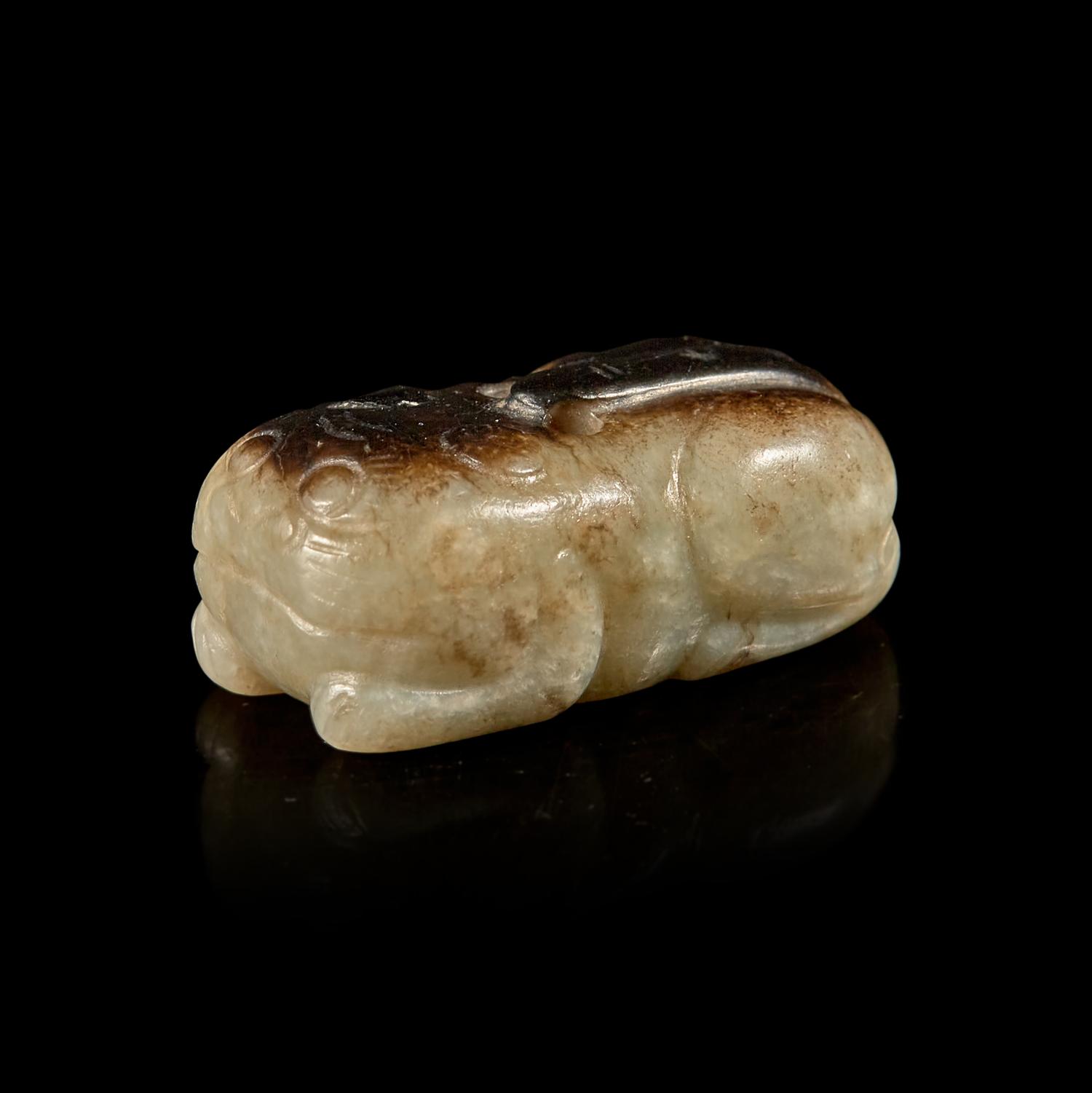 A Small Chinese Black and Celadon-Grey Jade Cat, Ming Dynasty 明 灰褐玉卧貓