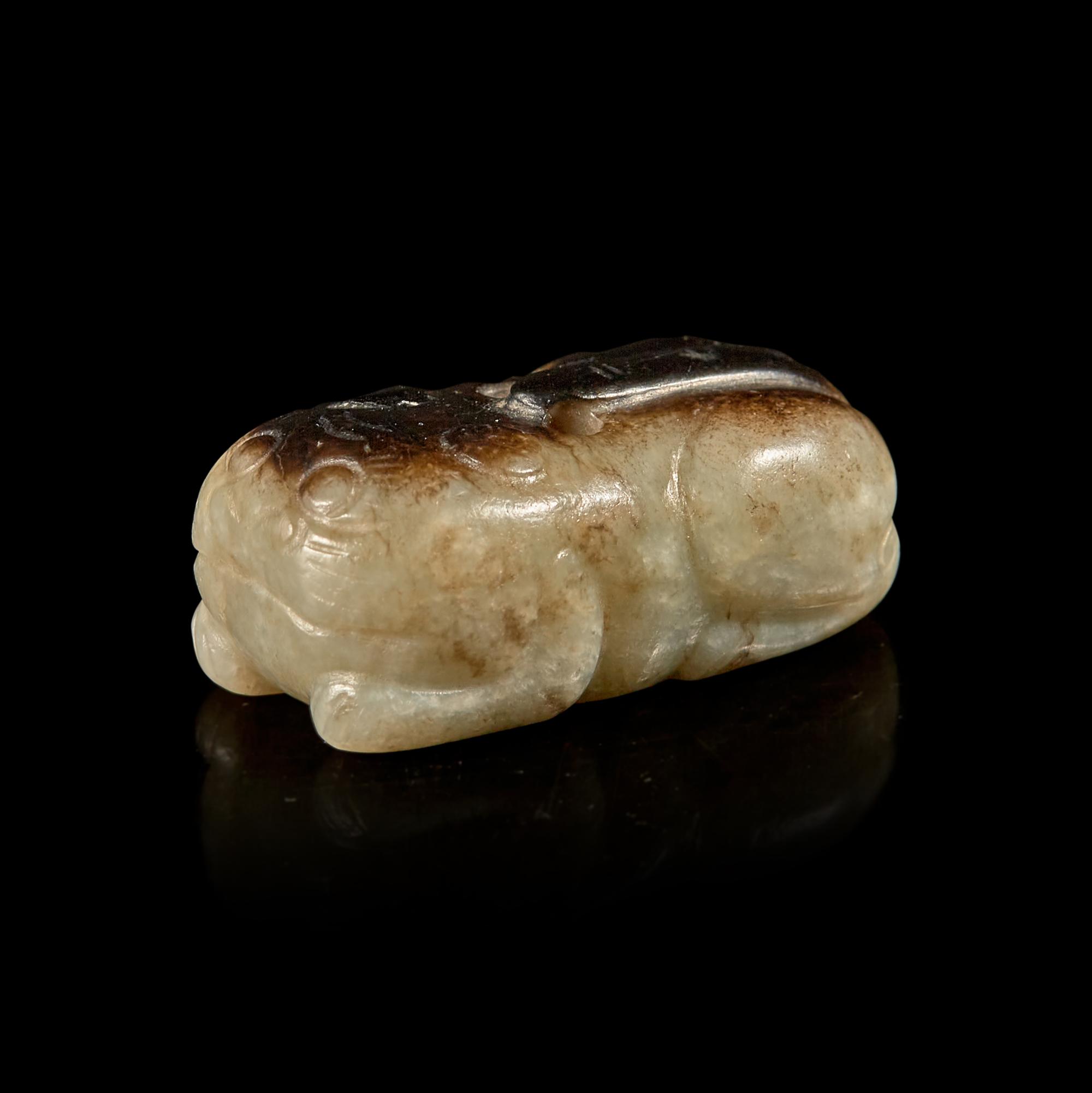 A Small Chinese Black and Celadon-Grey Jade Cat, Ming Dynasty 明 灰褐玉卧貓