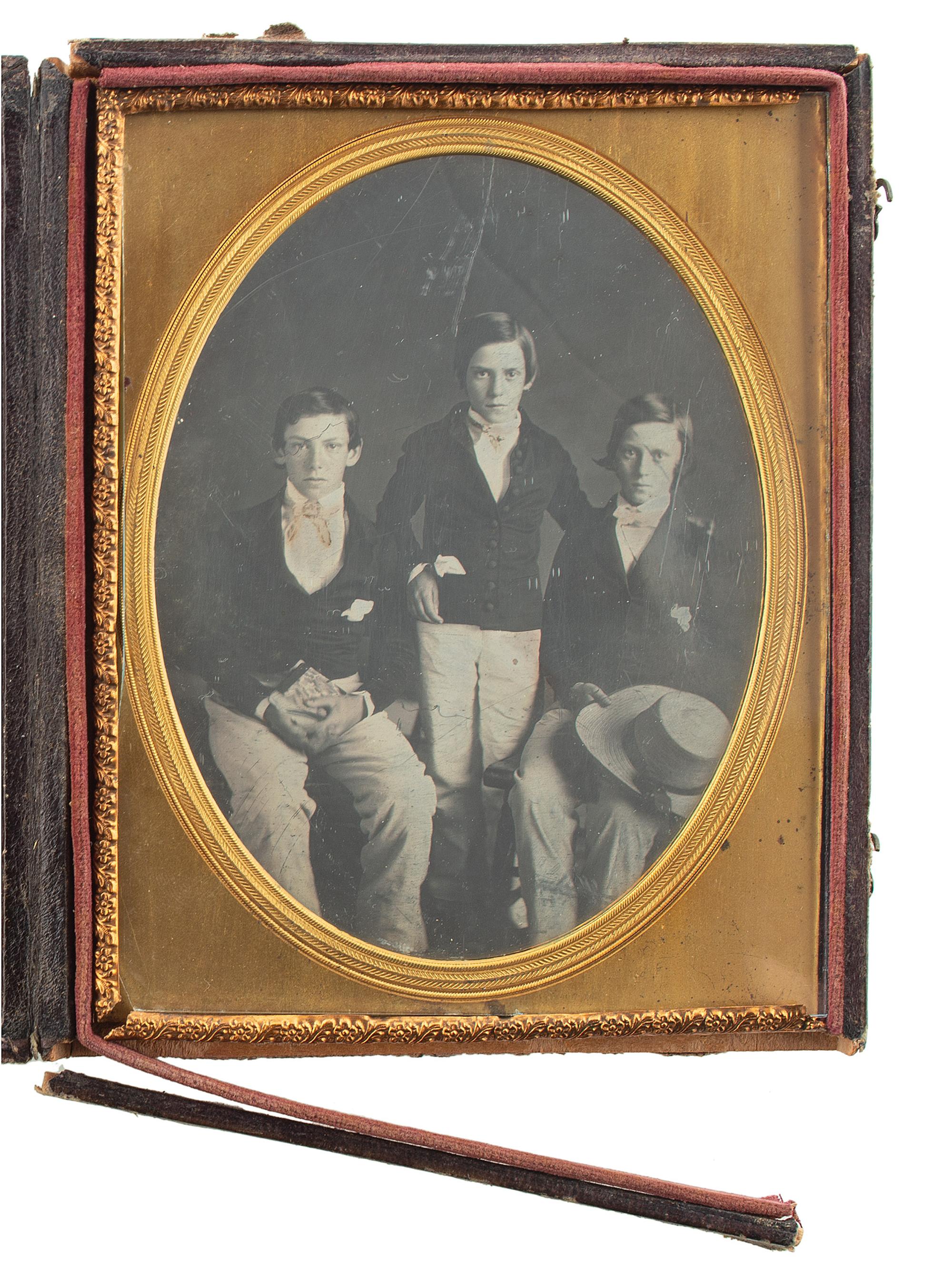 [EARLY PHOTOGRAPHY]. Half plate daguerreotype of three young lads. 1849.