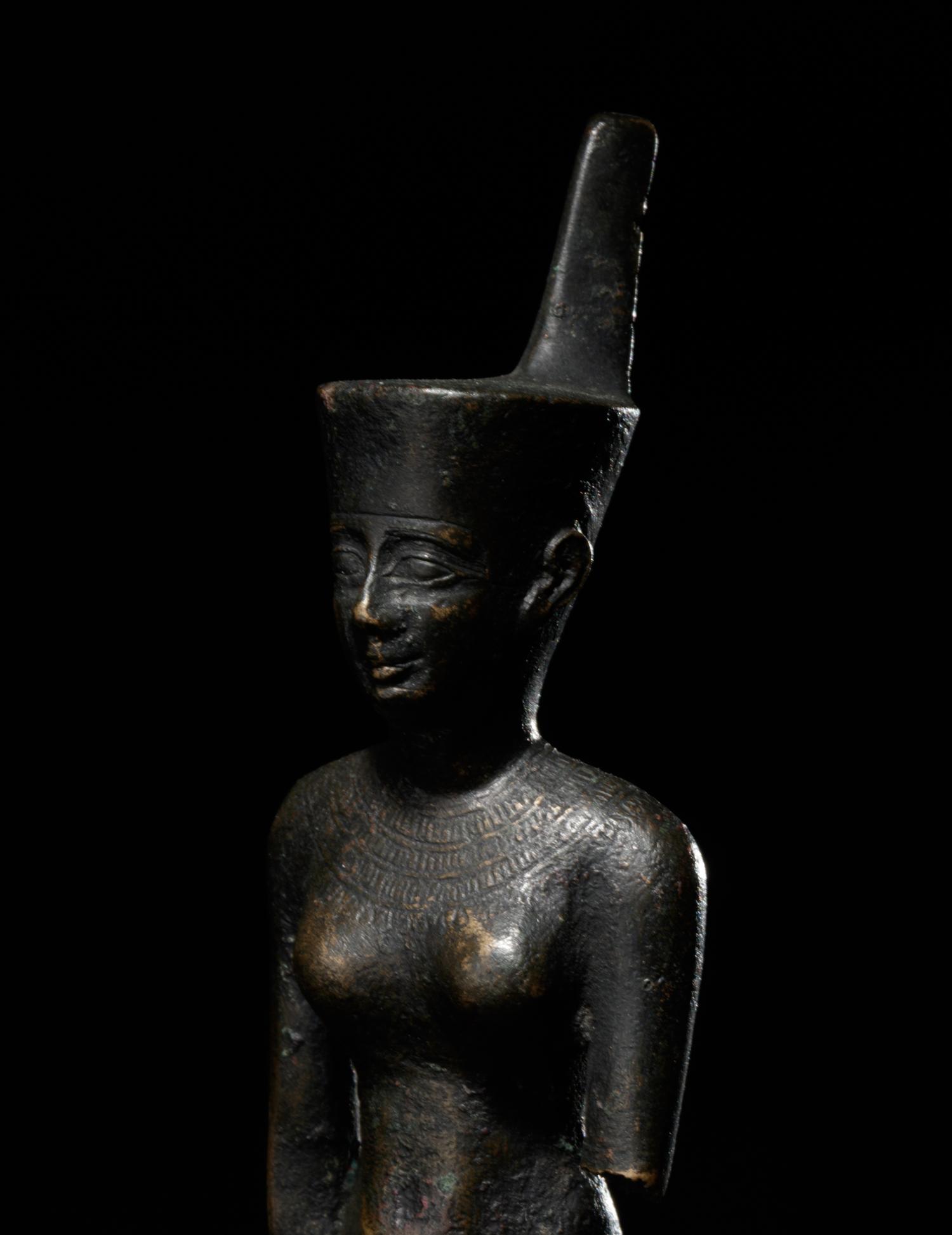 An Egyptian Bronze Striding Neith