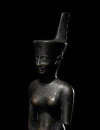 An Egyptian Bronze Striding Neith