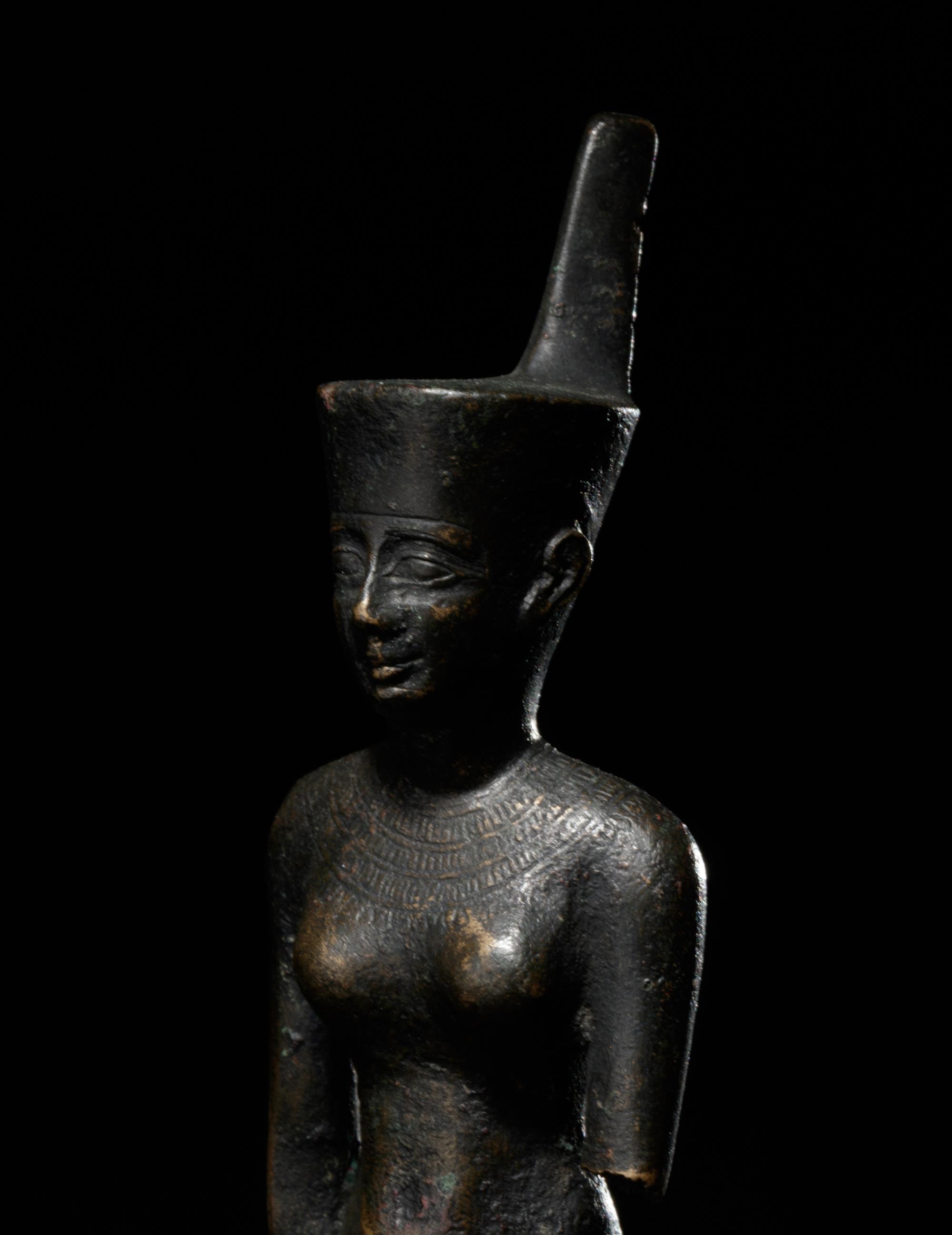 An Egyptian Bronze Striding Neith
