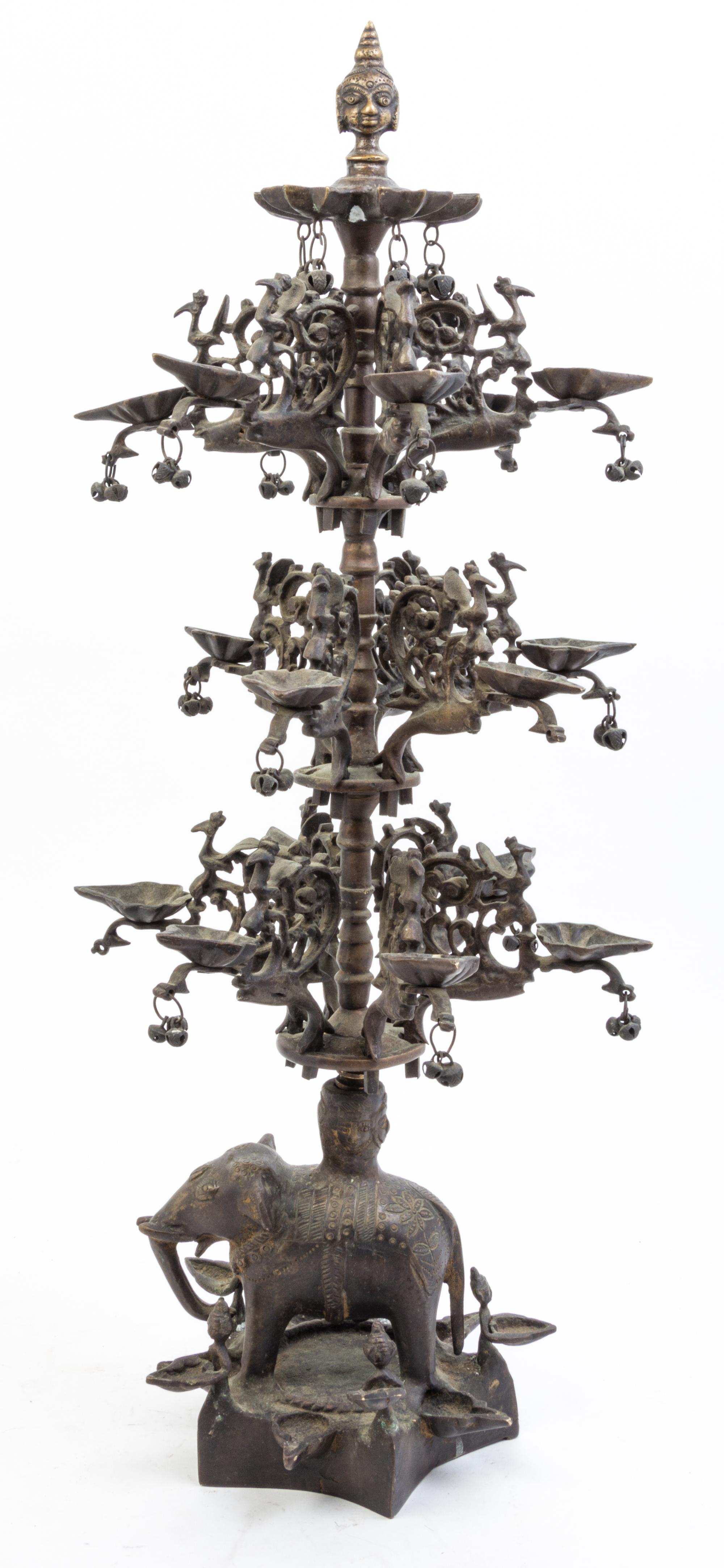 An Indian Bronze Figural Oil Lamp Height 26 inches.