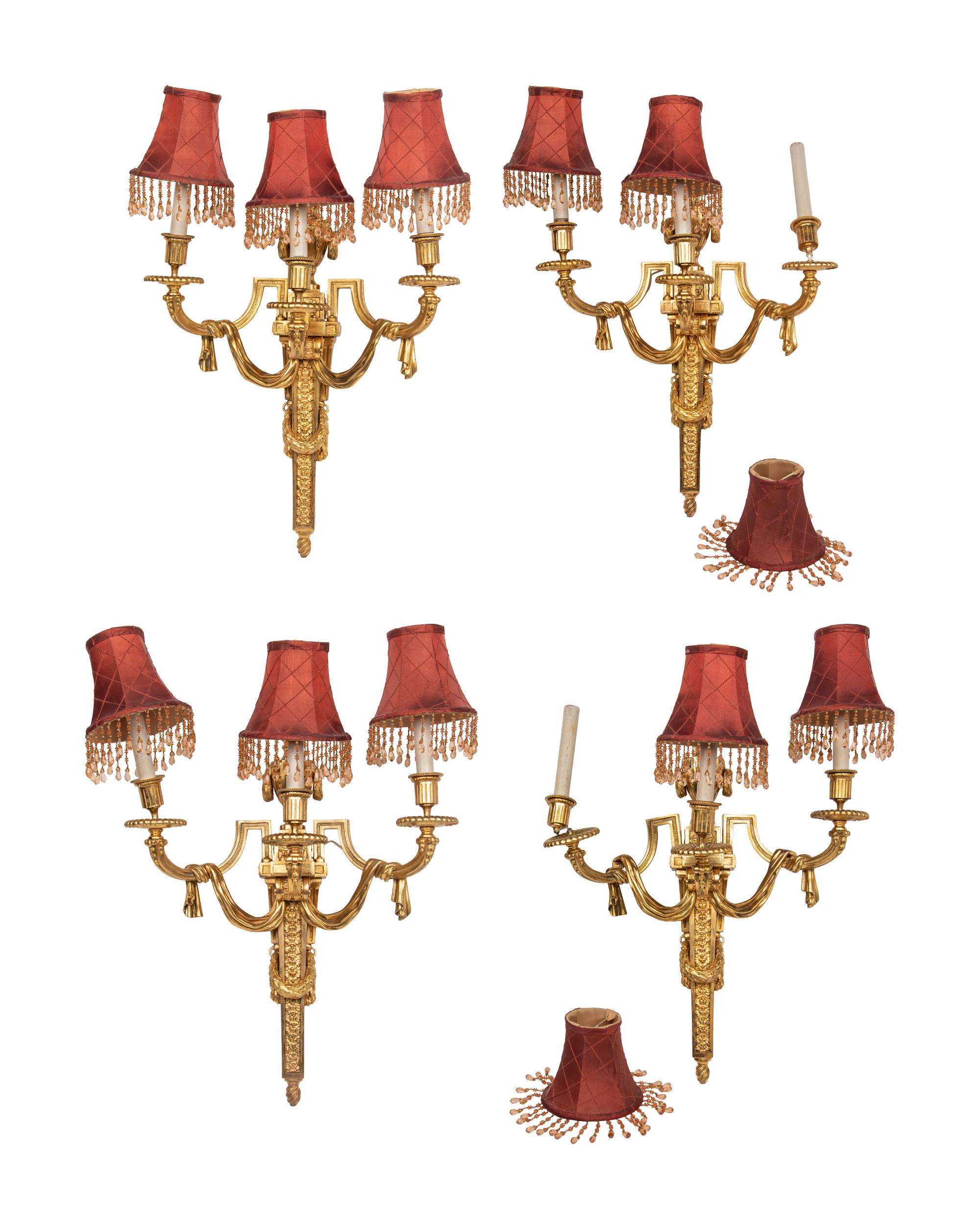 A Set of Four Louis XVI Style Gilt-Bronze Three-Light Sconces