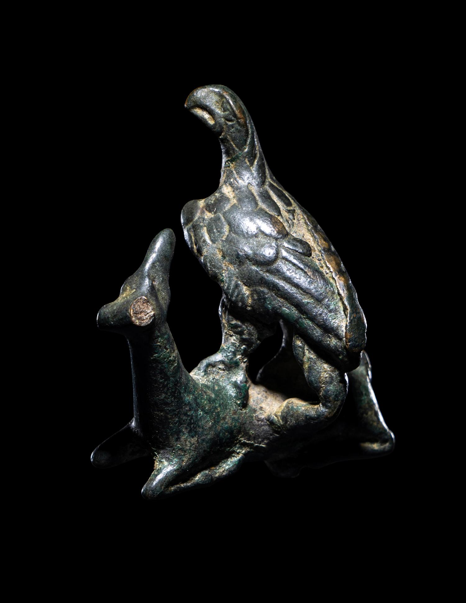 A Roman Bronze Eagle Grasping a Deer