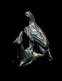 A Roman Bronze Eagle Grasping a Deer
